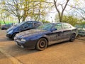 Old dusty dark blue Alfa Romeo sedan four doors parked Royalty Free Stock Photo