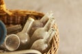 Old dusty glass bottles in a wicker basket Royalty Free Stock Photo