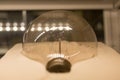 Old dusty light bulb glowing in the dark Royalty Free Stock Photo