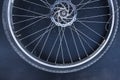 Old massive bike wheel on dark background