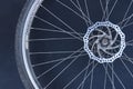 Old massive bike wheel on dark background