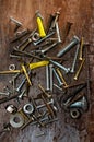 Old Dusty Rusted Nuts, Bolts and Screws on Rustic Wood