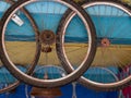 Dirty wheels hanging from the colorful ceiling. Royalty Free Stock Photo