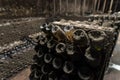 Old dusty sparkling wine bottles aging in an old winery in Republic of Moldova