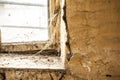 Old dusty window in the wall with cobweb