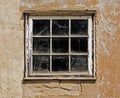 Old dusty window in the wall of house