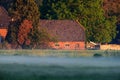 Old dutch farmhouse on misty morning Royalty Free Stock Photo