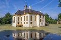 Old dutch mansion Fraeylemaborg with reflection in the water in