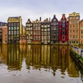 Old dutch medieval houses in Amsterdamon, view through the canal Royalty Free Stock Photo