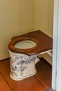 Old Dutch toilet with Delft blue porcelain and old fashioned toilet seat. Open air museum Enkhuizen