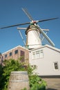 Traditional Dutch tower mill against a blue sky