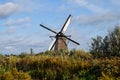 Old Dutch windmill. Blue sky background. Royalty Free Stock Photo