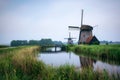 Old dutch windmill in cold morning scenery near Amsterdam Royalty Free Stock Photo