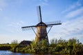 Old Dutch windmill. Blue sky background.