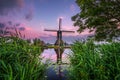 Old dutch windmill at sunset in Kinderdijk, Netherlands Royalty Free Stock Photo