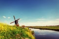 Old Dutch windmills spring from the canal in Rotterdam. Holland