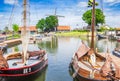 Old dutch wooden sailing ships in the inner harbor of Harderwijk Royalty Free Stock Photo