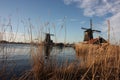 Old dutch wooden windmill in zaanse schans on the water of the river Zaan Royalty Free Stock Photo