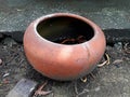 Old earthenware jar set on soil Royalty Free Stock Photo