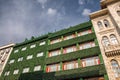 Old and ecological building with vegetation on the facace. Ecology and green planet concept. Blue sky Royalty Free Stock Photo