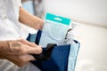 Old elderly carrying with medical mask,bottle of hand sanitizer or alcohol antiseptic gel in her cloth bag,concept of new normal