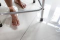Old elderly people walking on wet areas,water spilled on the floor at home,careful of slippage,asian senior woman stepping on the Royalty Free Stock Photo