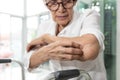 Old elderly scratching arm elbow itchy skin,skin irritation,atopic dermatitis or disorders of nerves and the nervous system,