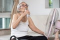 Old elderly woman drinking a bottle of water,keeping body water balance,drink a lot of water to prevent dehydration in heat hot Royalty Free Stock Photo
