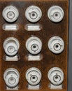 Old electric board with white ceramic fuses Royalty Free Stock Photo