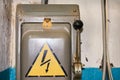 An old electric high-voltage switch with a painted danger sign. Royalty Free Stock Photo