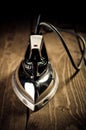 Old electric iron on the wooden background Royalty Free Stock Photo