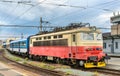 Old electric locomotive with a passenger train at Brno station, Czech Republic Royalty Free Stock Photo