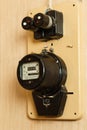 An electric meter hangs in the apartment along with two fuses Royalty Free Stock Photo