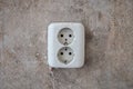 old electric plug socket on vintage wall during home renovation, apartment restoration Royalty Free Stock Photo