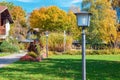 Old electric street lamps in autumn park in Germany Royalty Free Stock Photo