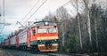 Electric train close-up in the autumn forest