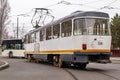 Old electric tram driving through the streets of downtown Bucharest on cloudy day Royalty Free Stock Photo