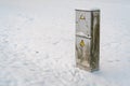 Old electrical cabinet in the nature in the snowdrift Royalty Free Stock Photo