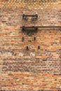 Old electrical fuses on brick wall structure