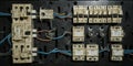 Old electrical panel with tangled wiring and circuit breakers Royalty Free Stock Photo