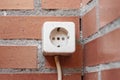 Old electrical socket on a brick wall Royalty Free Stock Photo