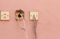 Old electricity socket and wires on cement wall with copy space for text and design art work