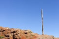 Old electrity pole on a rocky hill