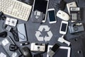Old electronic devices on a dark background. The concept of recycling and disposal of electronic waste. Royalty Free Stock Photo