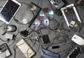 Old electronic devices on a dark background. The concept of recycling and disposal of electronic waste. Royalty Free Stock Photo