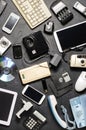 Old electronic devices on a dark background. The concept of recycling and disposal of electronic waste. Royalty Free Stock Photo