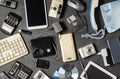 Old electronic devices on a dark background. The concept of recycling and disposal of electronic waste. Royalty Free Stock Photo