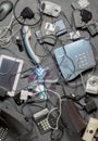 Old electronic devices on a dark background. The concept of recycling and disposal of electronic waste. Royalty Free Stock Photo
