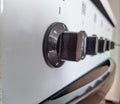 old electronic stove regulators and turntables in the kitchen.