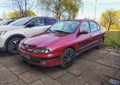 Old elegant classic red Renault Megane I four doors sedan car